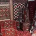Selling handicraft products by an Ilami craftsman under the shadow of export